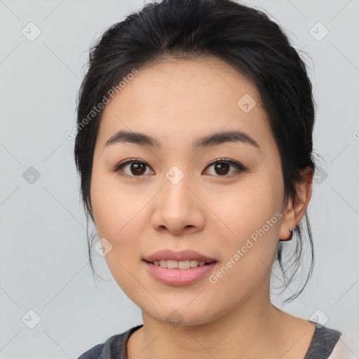 Joyful asian young-adult female with medium  black hair and brown eyes