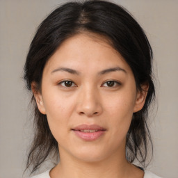 Joyful asian young-adult female with medium  brown hair and brown eyes