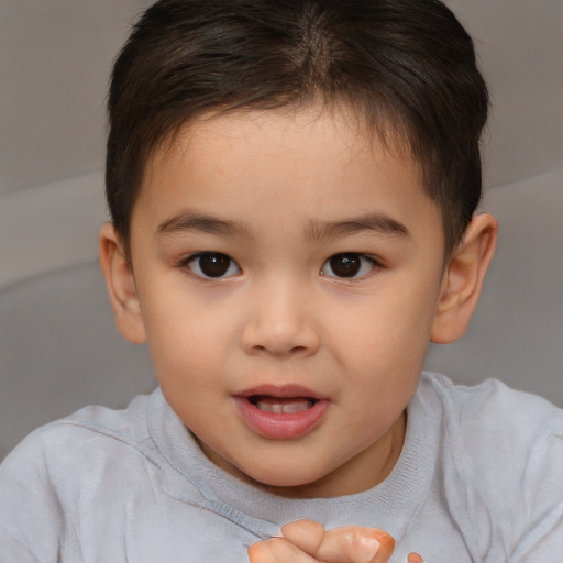 Joyful white child female with short  brown hair and brown eyes