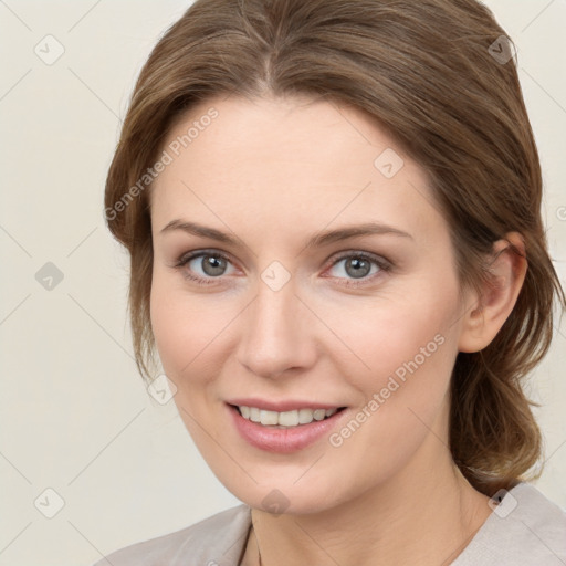 Joyful white young-adult female with medium  brown hair and grey eyes