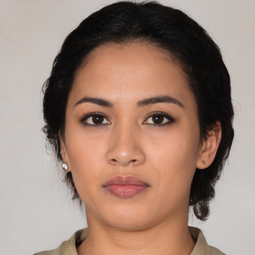 Neutral latino young-adult female with medium  black hair and brown eyes