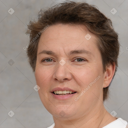 Joyful white adult female with short  brown hair and brown eyes