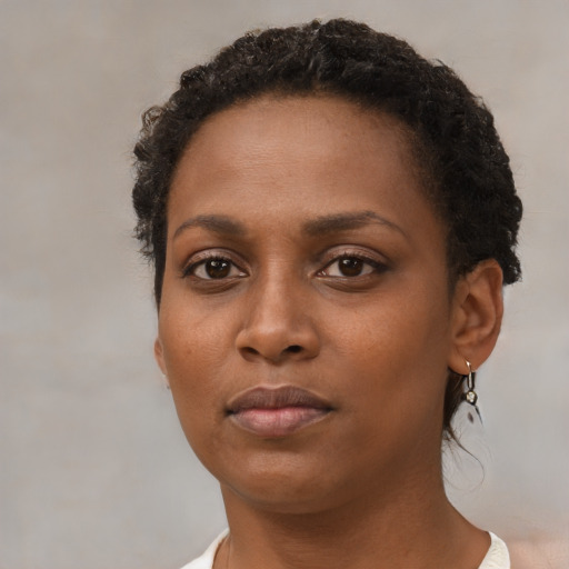 Neutral black young-adult female with short  brown hair and brown eyes