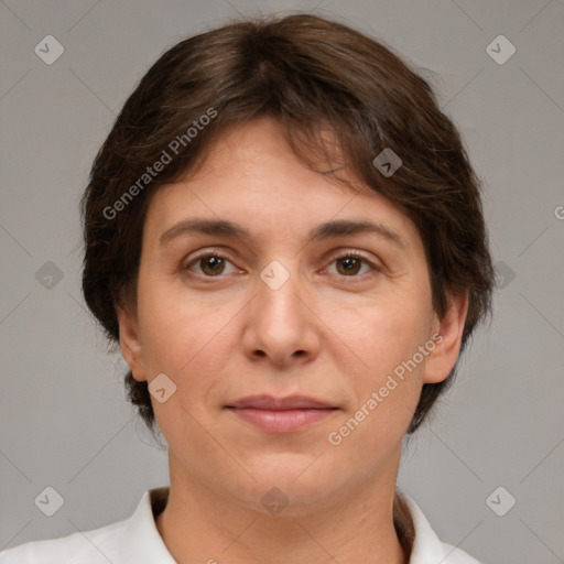 Joyful white adult female with short  brown hair and brown eyes