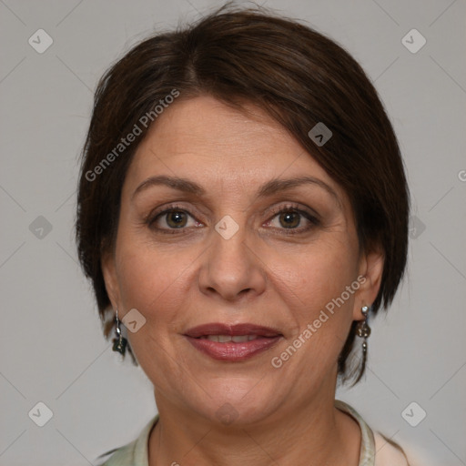 Joyful white adult female with medium  brown hair and brown eyes