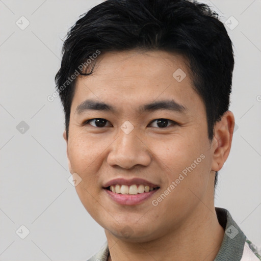 Joyful asian young-adult male with short  black hair and brown eyes