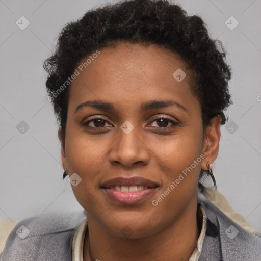 Joyful black young-adult female with short  brown hair and brown eyes