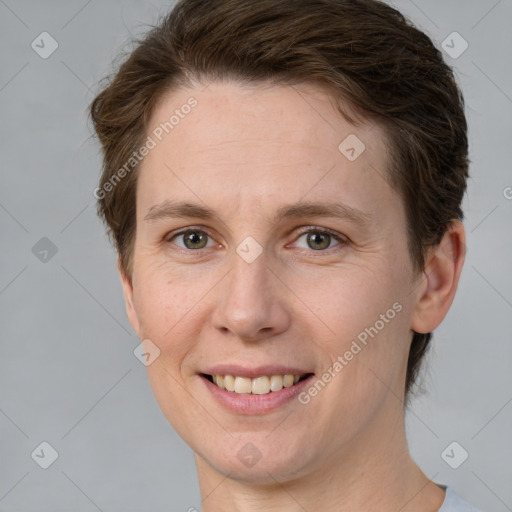 Joyful white adult female with short  brown hair and brown eyes