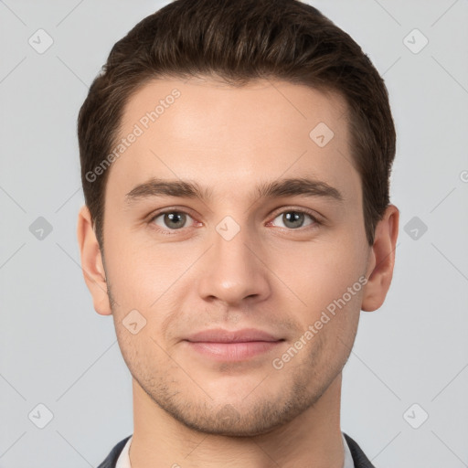 Joyful white young-adult male with short  brown hair and brown eyes