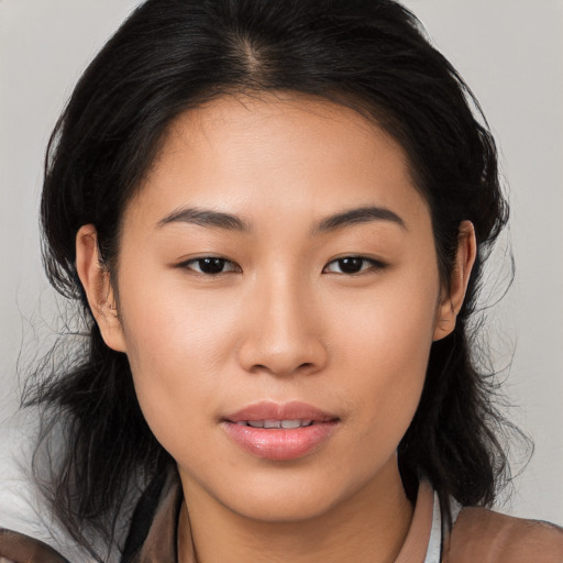 Joyful asian young-adult female with medium  black hair and brown eyes