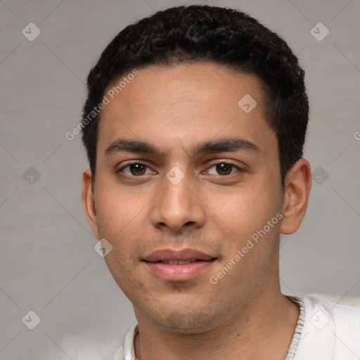 Joyful white young-adult male with short  black hair and brown eyes