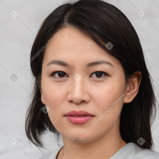 Joyful asian young-adult female with medium  brown hair and brown eyes