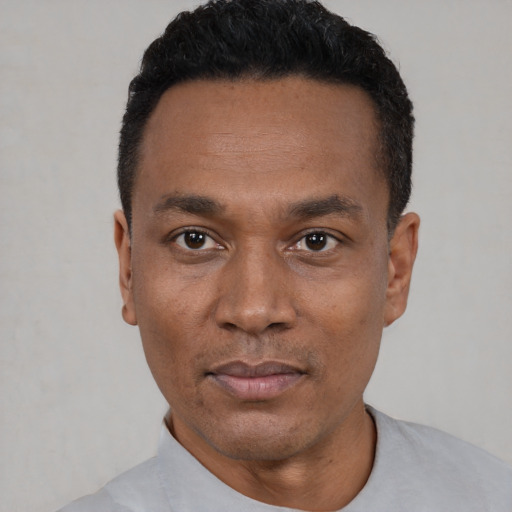 Neutral black adult male with short  black hair and brown eyes