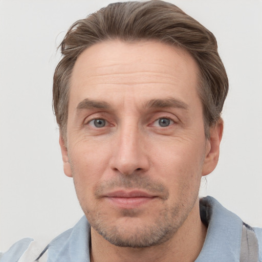 Joyful white adult male with short  brown hair and grey eyes