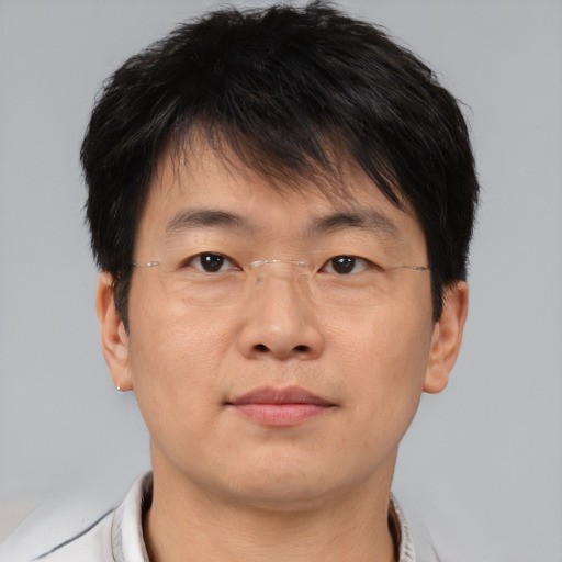 Neutral asian adult male with short  brown hair and brown eyes
