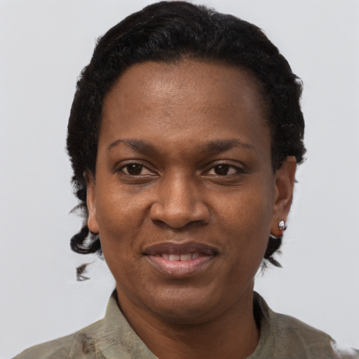 Joyful black young-adult female with short  black hair and brown eyes