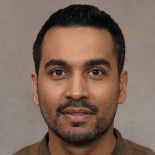 Neutral latino young-adult male with short  black hair and brown eyes