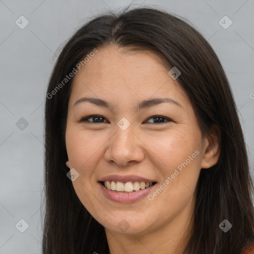 Joyful latino young-adult female with long  brown hair and brown eyes