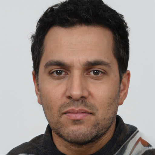 Neutral white adult male with short  black hair and brown eyes