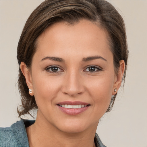 Joyful white young-adult female with medium  brown hair and brown eyes