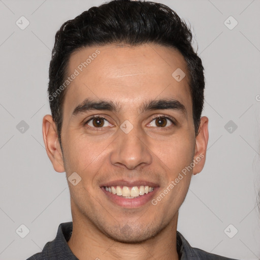 Joyful white young-adult male with short  black hair and brown eyes