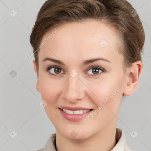 Joyful white young-adult female with short  brown hair and grey eyes