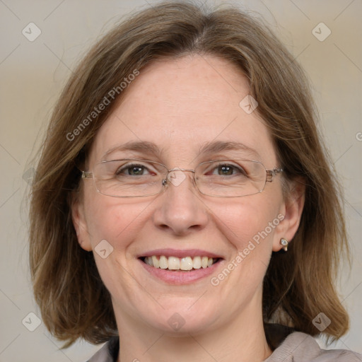 Joyful white adult female with medium  brown hair and blue eyes