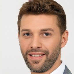 Joyful white young-adult male with short  brown hair and brown eyes