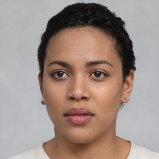 Neutral latino young-adult female with short  black hair and brown eyes