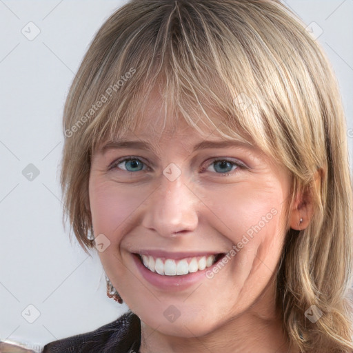 Joyful white young-adult female with medium  brown hair and blue eyes