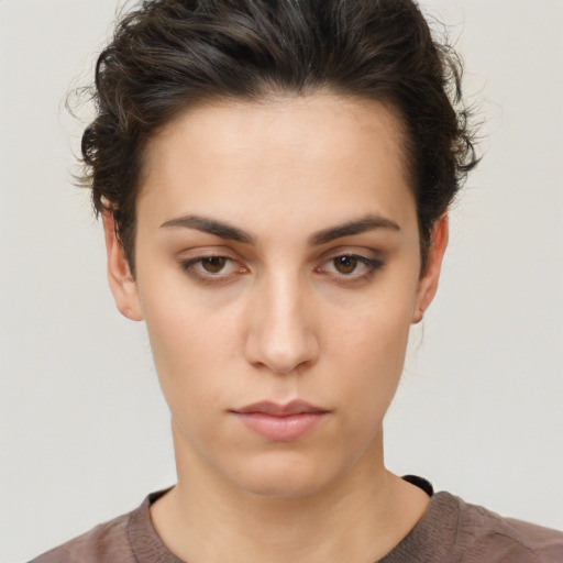 Neutral white young-adult female with short  brown hair and brown eyes