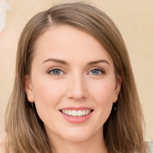 Joyful white young-adult female with long  brown hair and green eyes