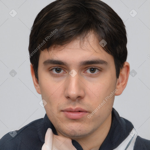 Neutral white young-adult male with short  brown hair and brown eyes