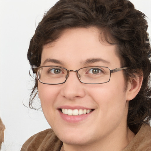 Joyful white young-adult female with medium  brown hair and green eyes