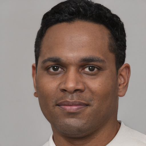 Neutral black young-adult male with short  black hair and brown eyes