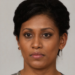 Neutral black young-adult female with short  black hair and brown eyes