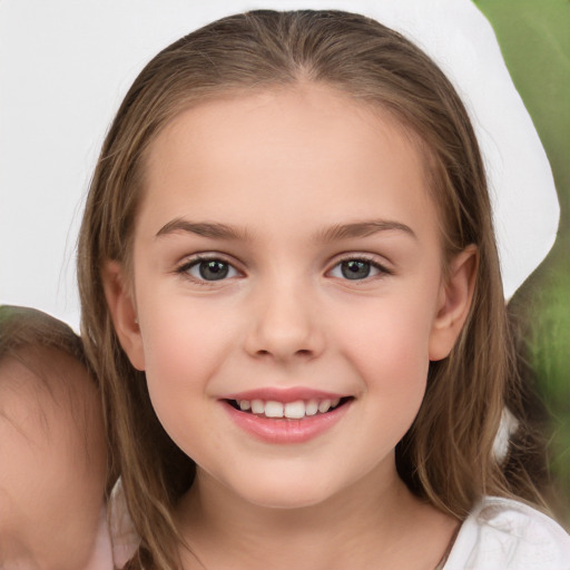 Joyful white child female with medium  brown hair and brown eyes