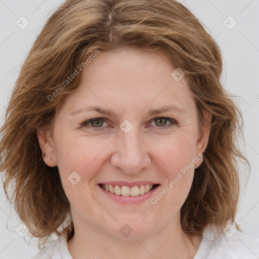 Joyful white young-adult female with medium  brown hair and blue eyes