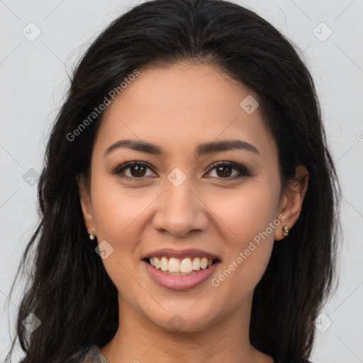 Joyful latino young-adult female with long  brown hair and brown eyes