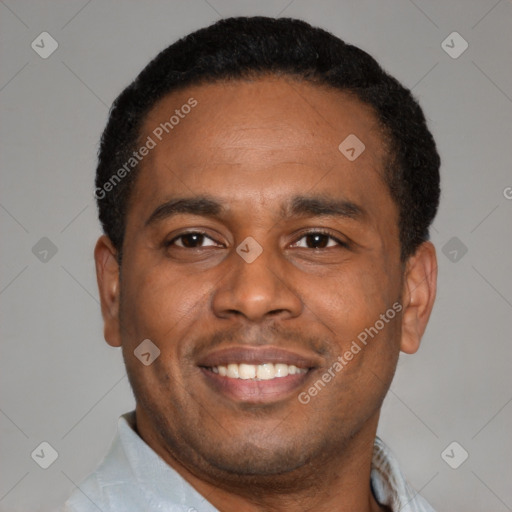 Joyful latino young-adult male with short  brown hair and brown eyes