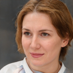 Joyful white adult female with medium  brown hair and brown eyes