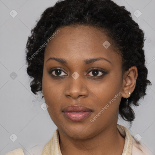 Joyful black young-adult female with medium  black hair and brown eyes