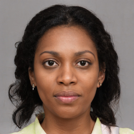Neutral black young-adult female with medium  black hair and brown eyes