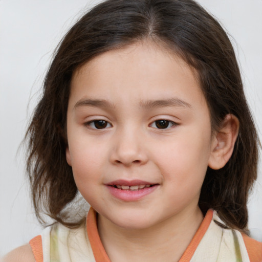 Joyful white child female with medium  brown hair and brown eyes