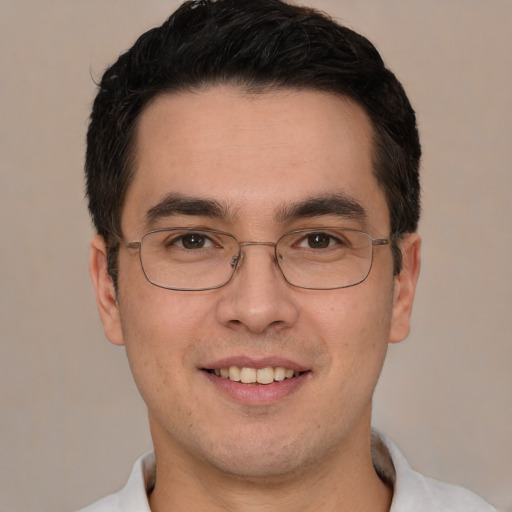 Joyful white young-adult male with short  black hair and brown eyes