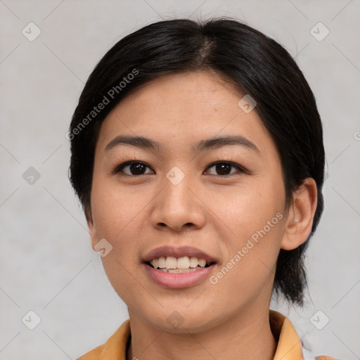 Joyful latino young-adult female with medium  black hair and brown eyes