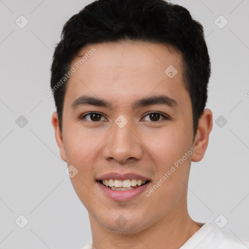 Joyful white young-adult male with short  black hair and brown eyes