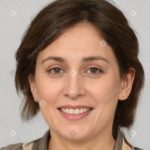 Joyful white adult female with medium  brown hair and brown eyes