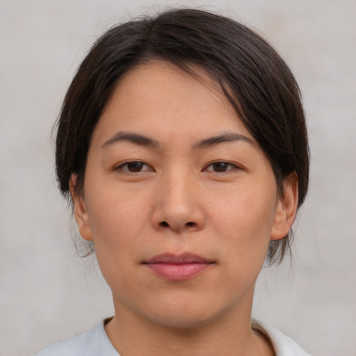 Neutral asian young-adult female with medium  brown hair and brown eyes