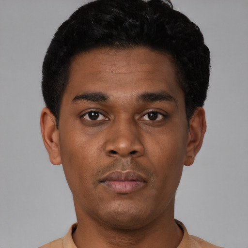 Neutral black young-adult male with short  black hair and brown eyes